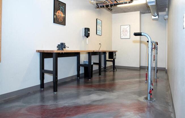 A room with a table and chairs and a pull up bar.