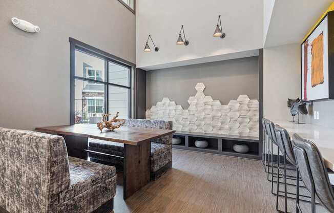 A modern dining room with a wooden table and chairs.