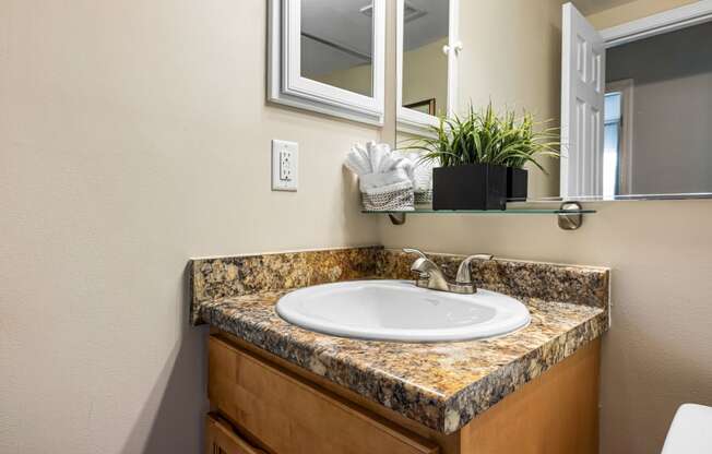 a bathroom with a sink and mirror
