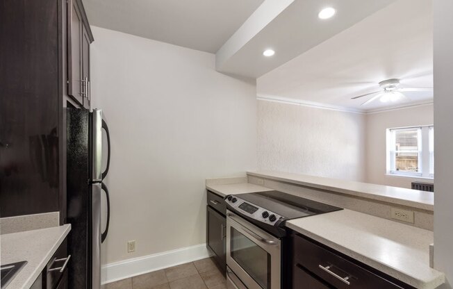 a kitchen with stainless steel appliances and a counter top