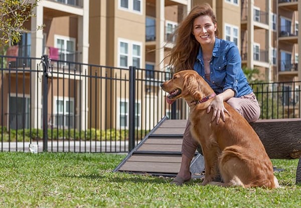 Woman with Dog at Dog Park