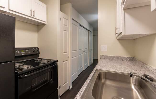 This is a photo of the kitchen in a 849 square foot split 2 bedroom, 2 bath apartment at Park Lane Apartments in Cincinnati, OH.
