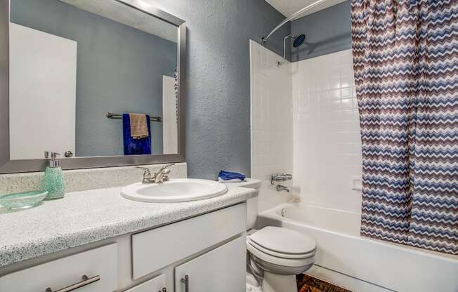 a bathroom with a sink toilet and bathtub