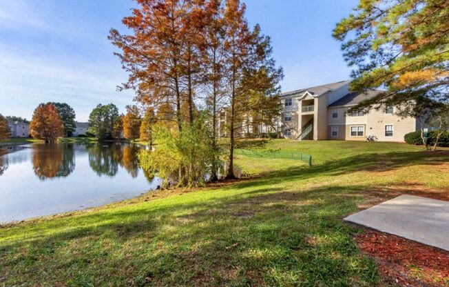 Lake view with building exterior and autumnal leaves