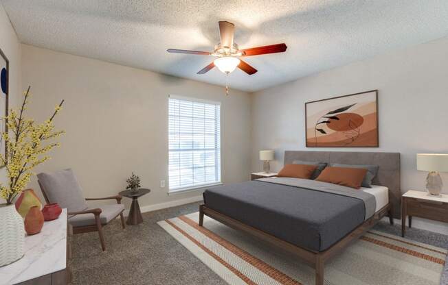 a bedroom with a bed and a ceiling fan
