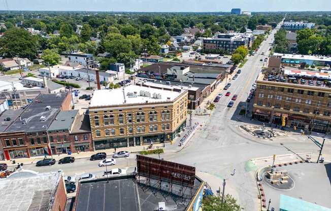 A city street with a large building under construction.