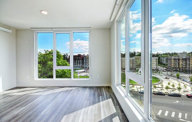 A room with a view of the street and buildings outside. at Ravello Apartments, Washington