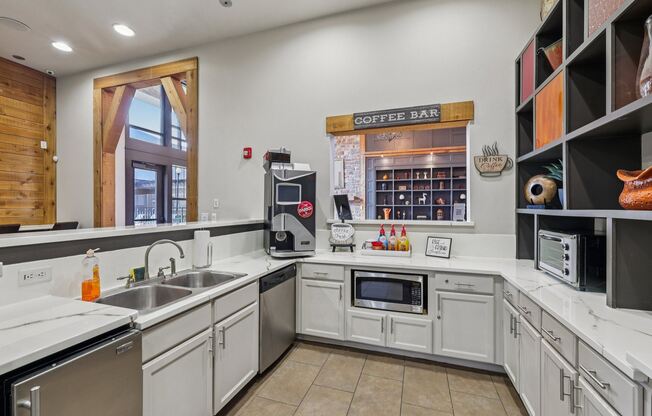 A coffee bar is located in the corner of a modern kitchen.
