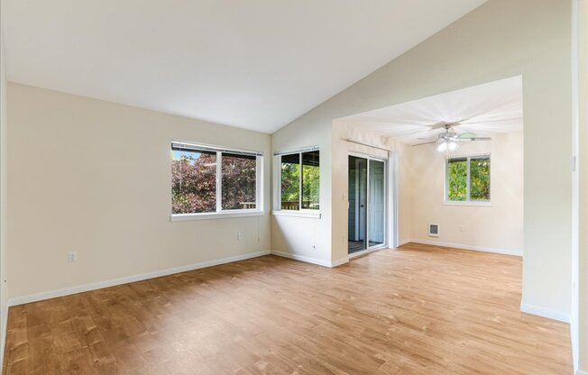 Cascade Woods living area with sliding glass door and natural light