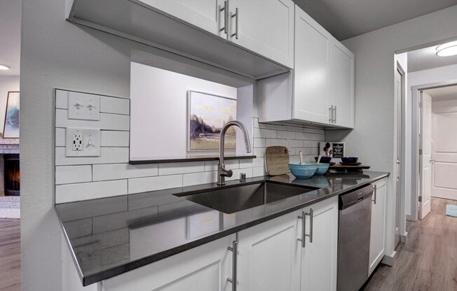 a kitchen with a sink and a dishwasher