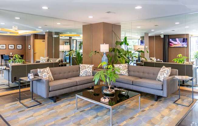 A lobby with two sofas and a coffee table.