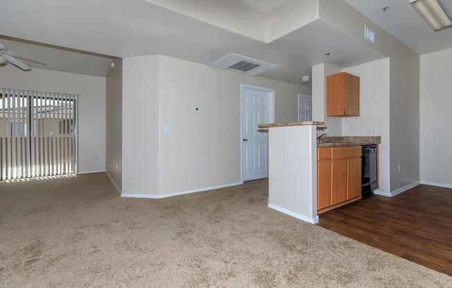 a large empty room with a wooden floor