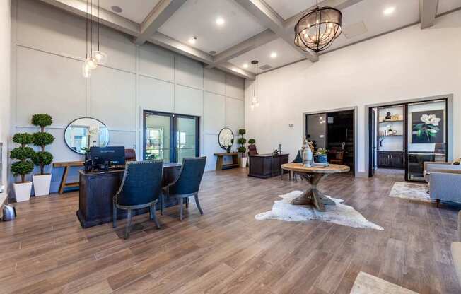 A modern living room with dark wood floors and furniture.