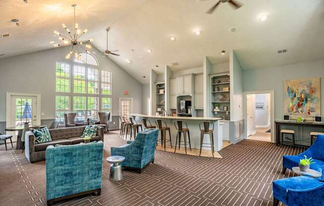 A spacious clubhouse with a kitchen and lounge area.