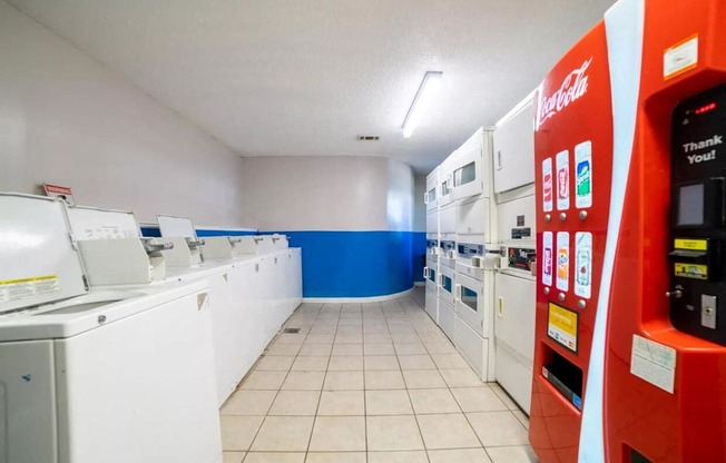A Coca-Cola vending machine is on the right.