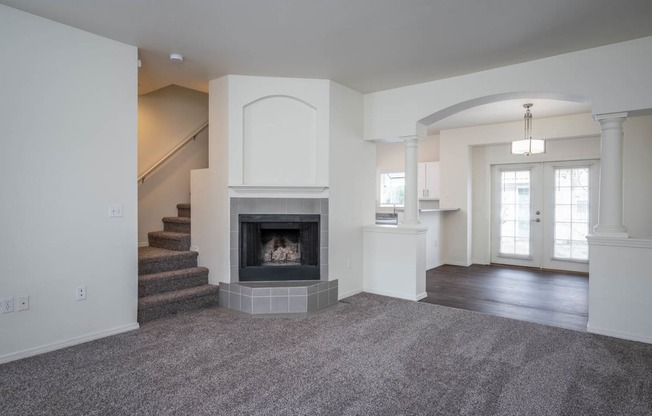 Village at Main Street | 2x2 Spacious Living Room with Corner Fireplace and Dining Room