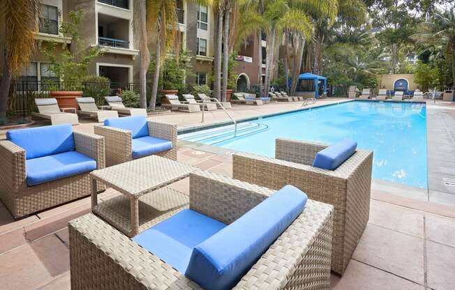 Outdoor pool area with lounge chairs