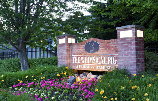 The Whimsical Pig Apartments Exterior Monument Sign
