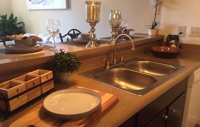 a table topped with lots of counter space and a sink