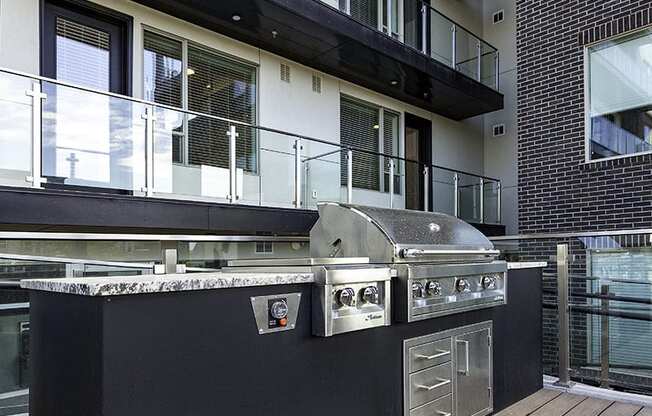 a barbecue grill in the middle of a patio