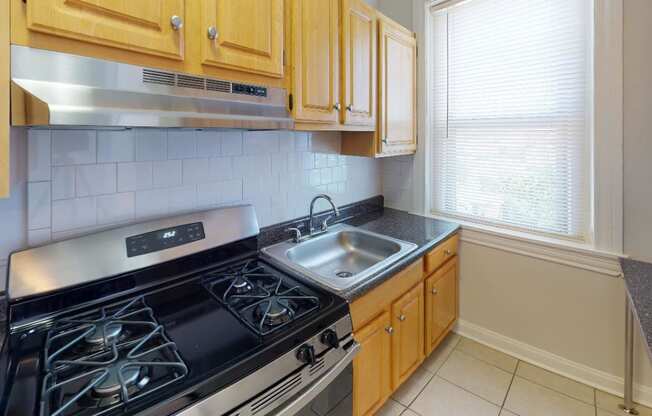 kitchen at hampton courts apartments in dc with stainless steel appliances