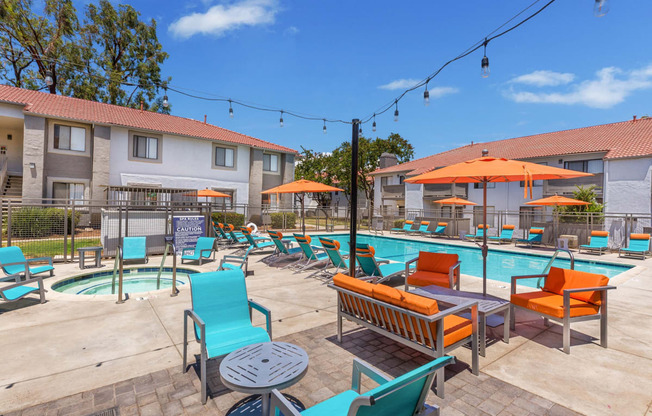 our apartments have a resort style pool with lounge chairs and umbrellas