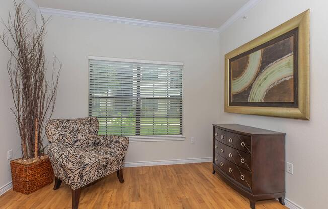 a living room filled with furniture and a large window