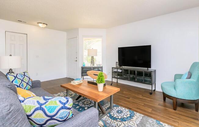 a living room filled with furniture and a table