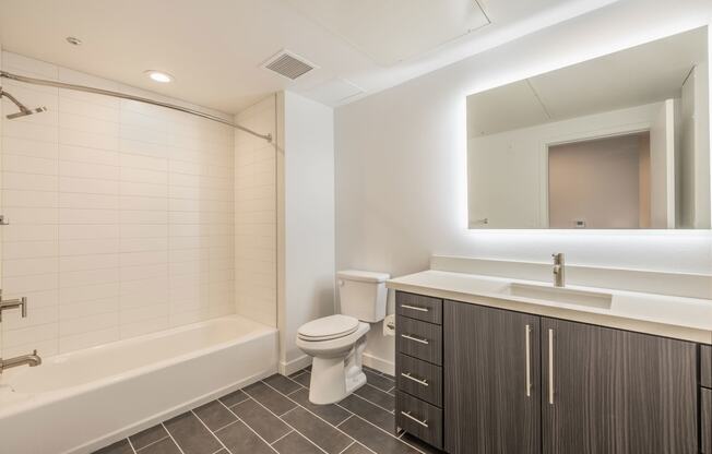 a bathroom with a sink toilet and a bath tub