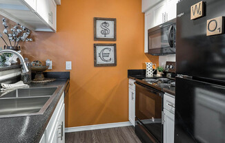 a modern kitchen with stainless steel appliances