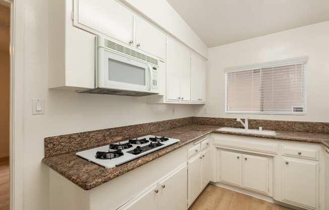 Kitchen with White Appliances and White Cabinets