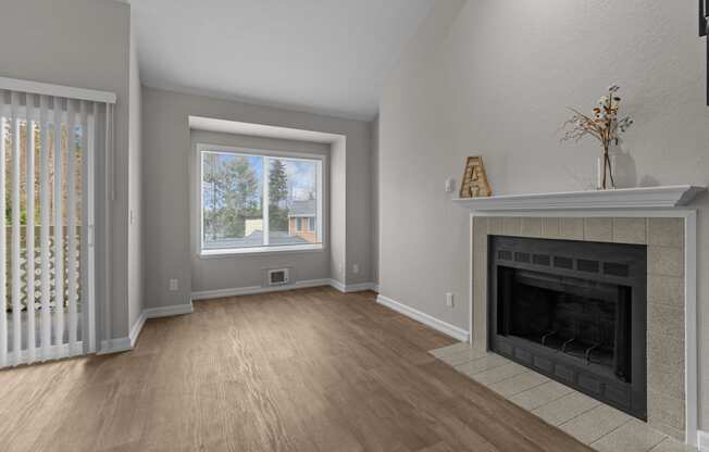 a living room with a fireplace and a window