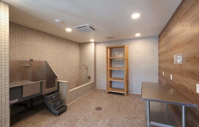 A bathroom with a shower and a wooden cabinet.