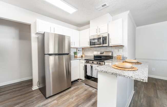 a kitchen with stainless steel appliances and a counter top