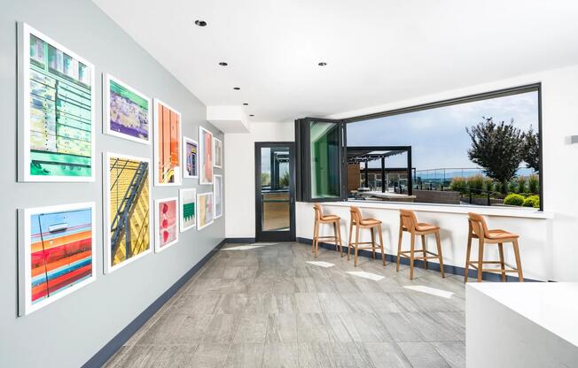 Bright and colorful details lead to the rooftop deck, with open-air bar seating and sweeping mountain views.