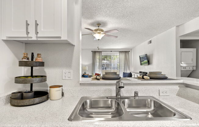 a kitchen with a sink and a microwave