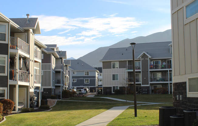 a view of the balconies of a building from the roof of another building