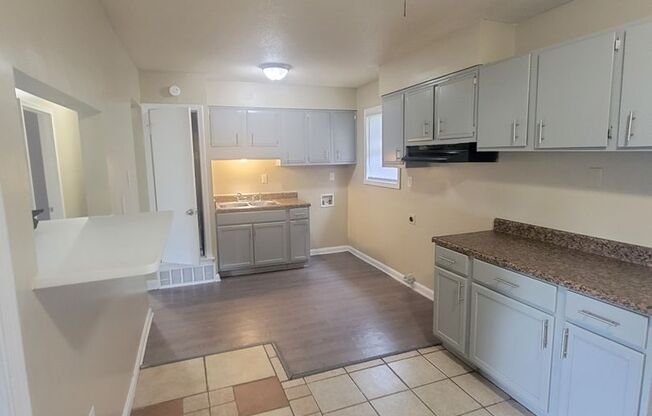 4 Success is offering this 3 bedroom 1 bath home with open kitchen. 1 car carport and huge backyard for entertaining. Central Heat and Air