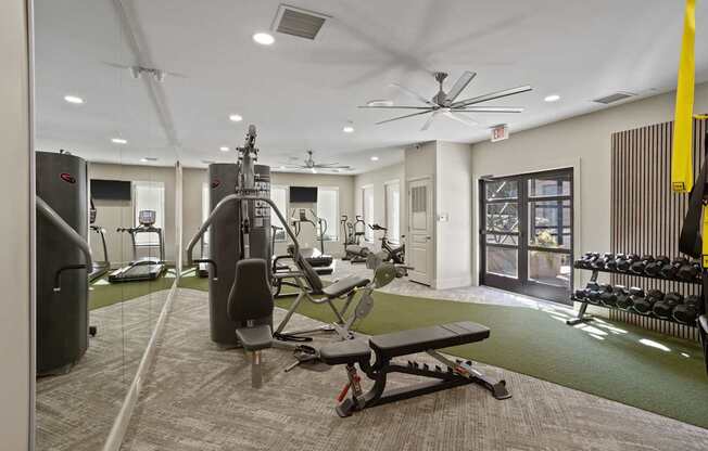 Flatiron West Trade Apartments 24 hour fitness center with free weights, cardio machines, and weightlifting machines