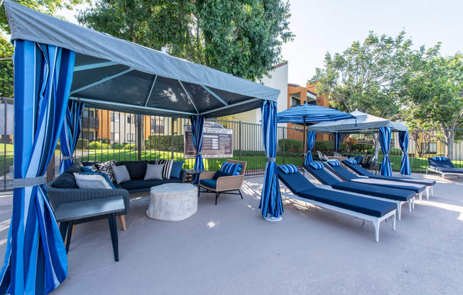 Resort style cabanas and lounge chairs