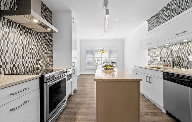 Rare Luxury 3-Story Townhome in Walton School District – Dual Kitchens, Double Decks & More!