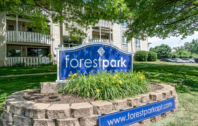 a yard with a sign in front of a building