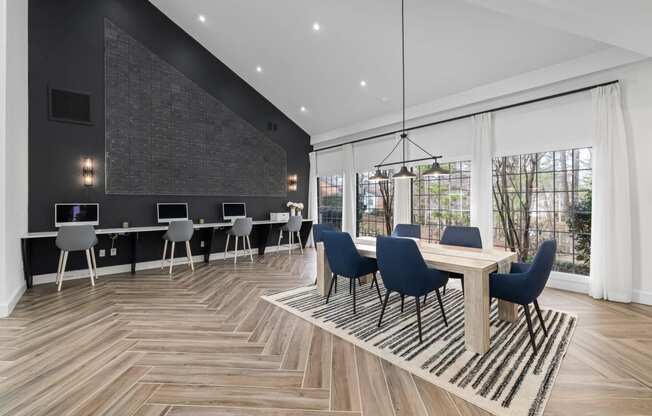 a conference room with a table and chairs and a large window