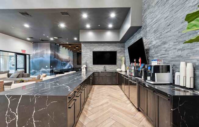 A modern kitchen with a marble countertop and wooden cabinets. at The Laurel Apartments, Chandler, 85286