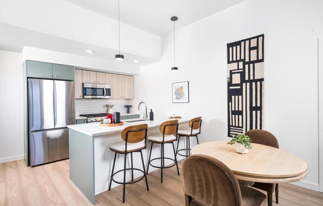 Bright, open kitchens at Modera Beaverton feature clean lines and generous islands—designed for everyday ease just minutes from Beaverton dining and transit.