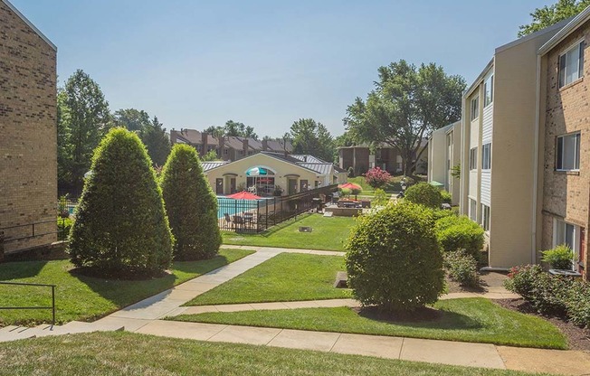 View of exterior landscaping and walkways for apartment complex at Tysons Glen Apartments and Townhomes, Falls Church