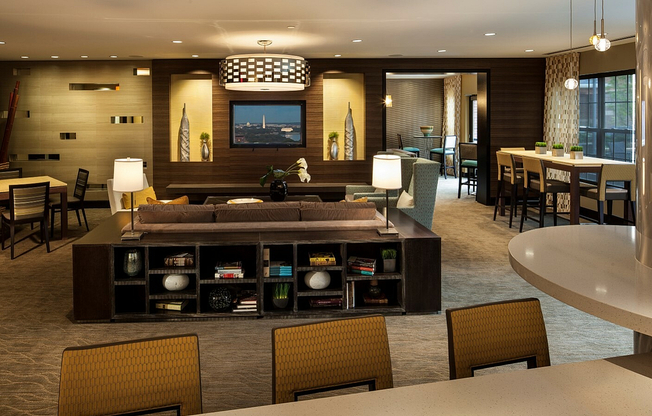 Contemporary Club Room With Bar Area, TV & Numerous Seating Areas