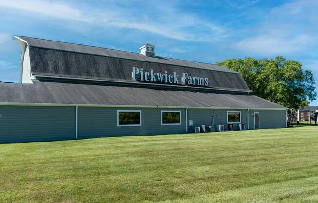a large blue building with the words pickwick farms on the roof