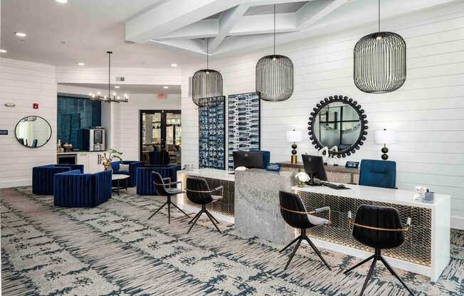 a large lobby with a reception desk and chairs
