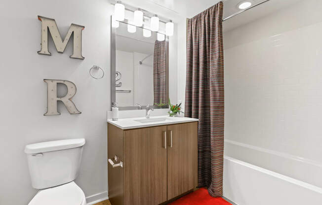 a bathroom with a toilet sink and bathtub